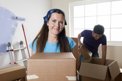 Team planning office removals in Penge with boxes and desks