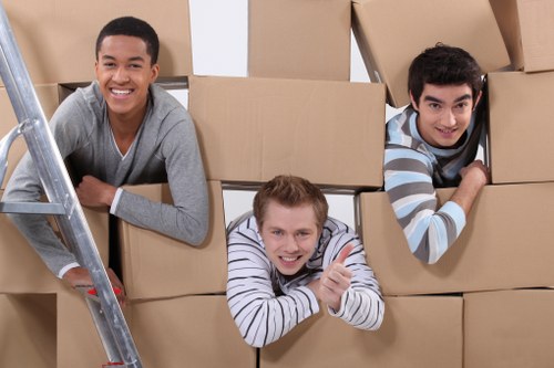 A moving team handling boxes during house removals