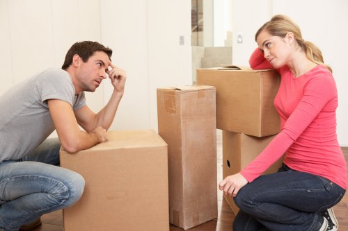 Family moving items into short-term storage in Penge