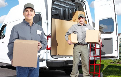 Local Penge movers handling furniture carefully during a home relocation
