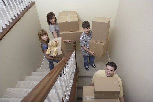 Professional movers handling office equipment during a Penge relocation